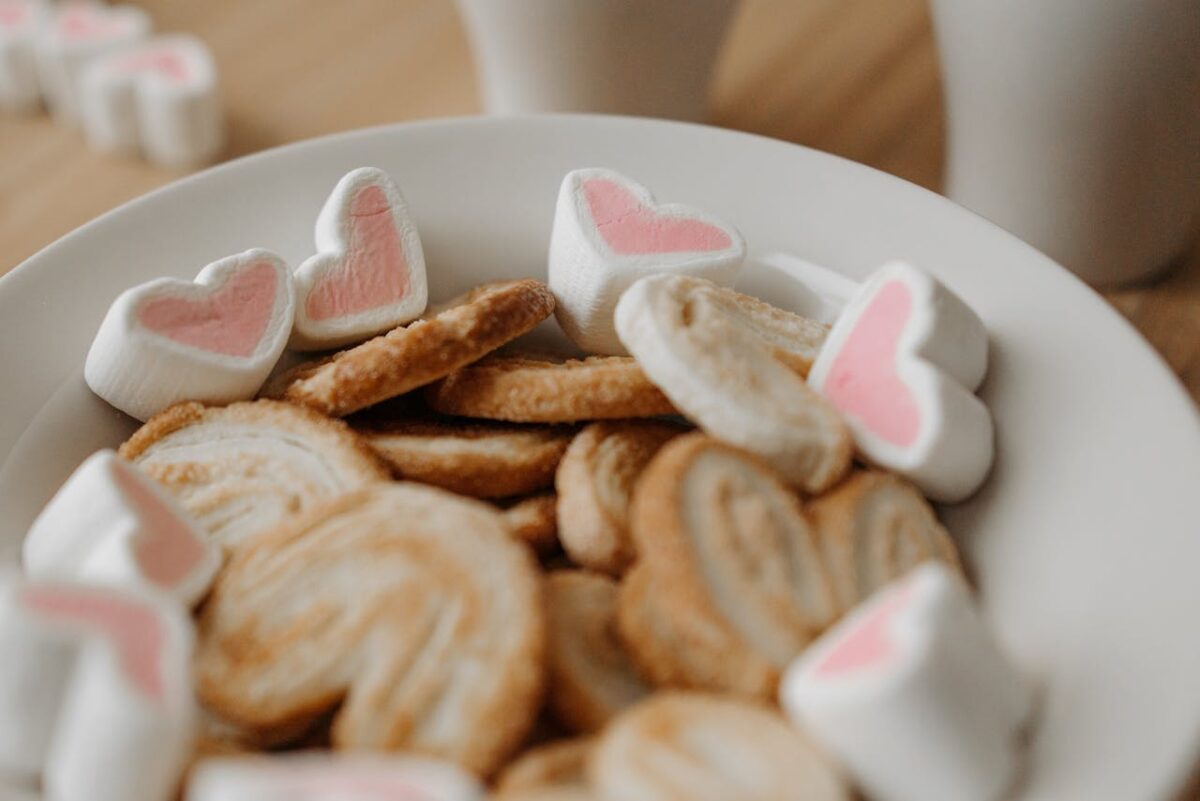 pexels photo 6549199 Close-up of heart-shaped marshmallows and biscuits in a bowl, perfect for snacking ideas.